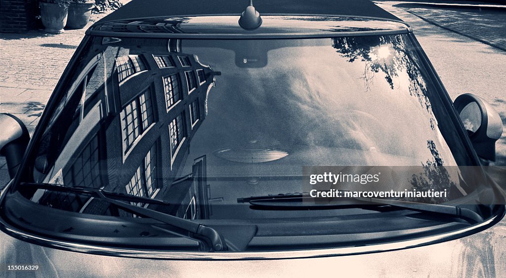 Typically Dutch architecture reflected in a car windscreen