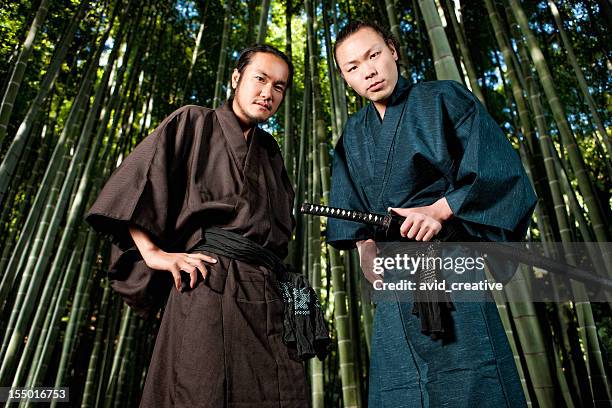 two warriors in bamboo - samurai sword stock pictures, royalty-free photos & images