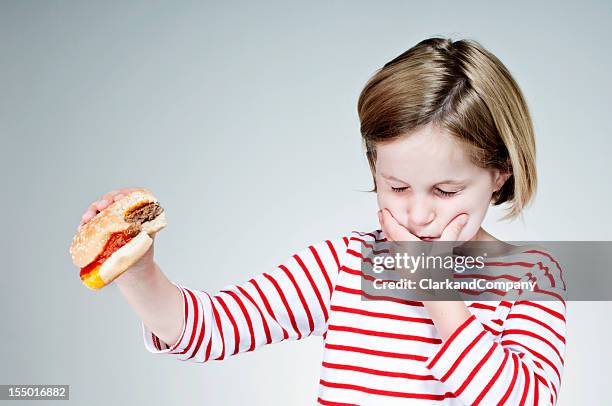 what's in that burger? - unpleasant taste stock pictures, royalty-free photos & images