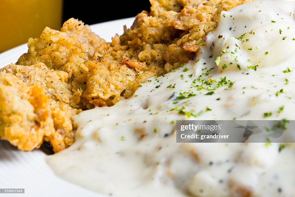 Bistec frito de pollo con cerveza