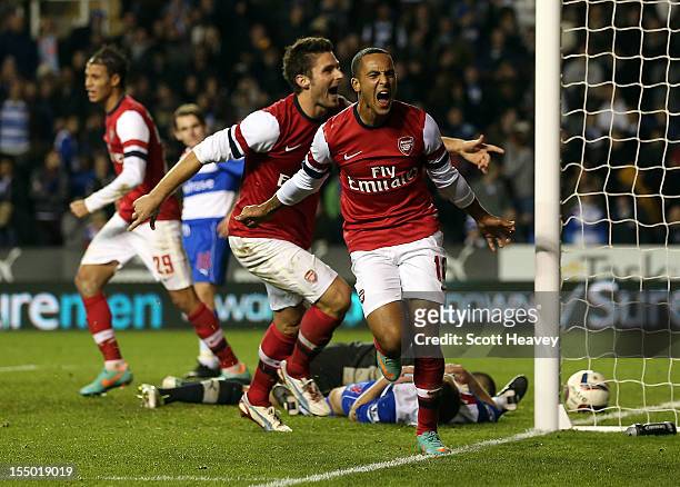 Theo Walcott of Arsenal celebrates their sixth goal during the Capital One Cup Fourth Round match between Reading and Arsenal at Madejski Stadium on...