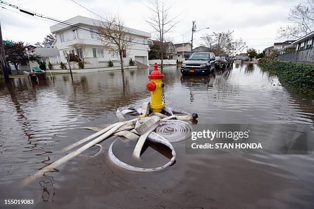 Flood damaged area is seen on October 30, 2012 in the Breezy Point area of Queens in New York that was hit hard by Hurricane Sandy. AFP PHOTO/Stan...