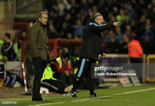 Paul Lambert, manager of Aston Villa gives instructions as Paolo Di Canio, manager of Swindon Town looks on during the Capital One Cup Fourth Round...