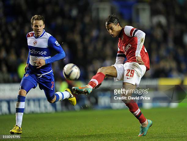 Marouane Chamakh scores Arsenal's seventh goal as Chris Gunter of Reading closes in during the Capital One Cup match between Arsenal and Reading at...