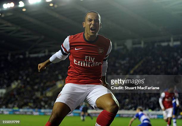 Theo Walcott celebrates scoring the sixth Arsenal goal with Olivier Giroud during the Capital One Cup match between Arsenal and Reading at Madejski...