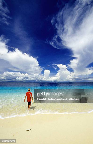 surfer in the hinako islands of indonesia. - indonesia hinako stock pictures, royalty-free photos & images