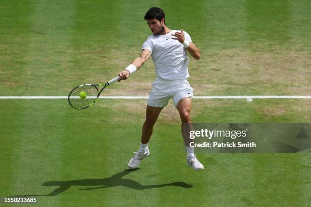 Carlos Alcaraz of Spain plays a forehand shot during the Men's Singles Final against Novak Djokovic of Serbia on day fourteen of The Championships...