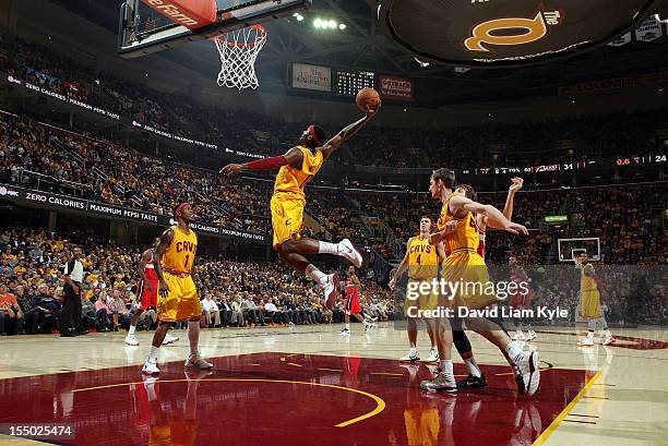 Miles of the Cleveland Cavaliers flies high t grab the rebound in the game against the Washington Wizards at The Quicken Loans Arena on October 30,...