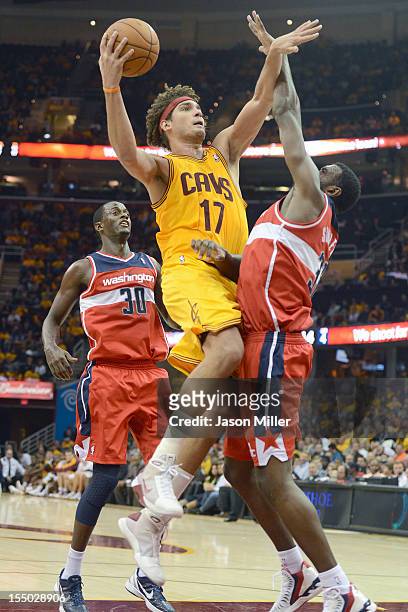 Anderson Varejao of the Cleveland Cavaliers shoots over Earl Barron and Chris Singleton of the Washington Wizards during the second half at Quicken...