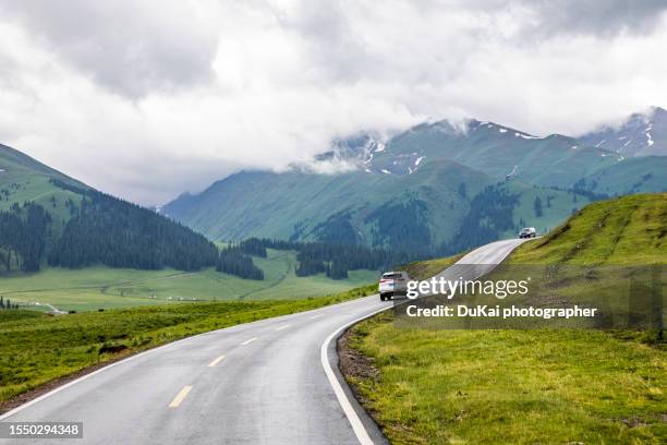 nalati grassland road, xinjiang province, china - distant hills stock pictures, royalty-free photos & images