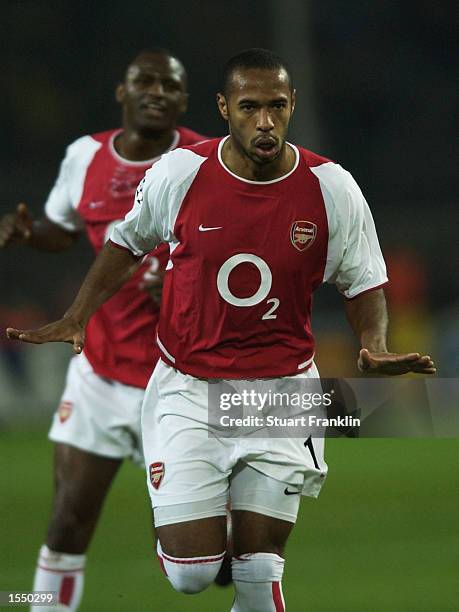 Thierry Henry of Arsenal celebrates scoring their first goal from a free kick during the Champions League First Phase Group A match between Borussia...