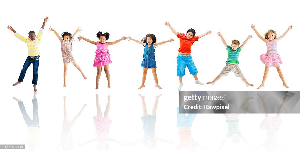 Group of cheerful kids jumping in the air