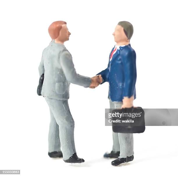 businessman handshake - figurine stock pictures, royalty-free photos & images