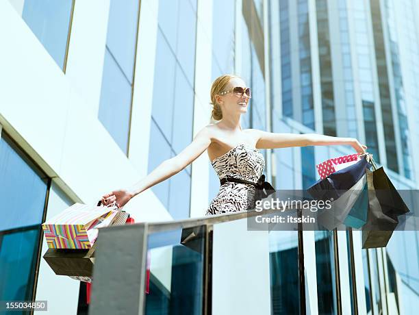 shopping - wrapping arm stock pictures, royalty-free photos & images