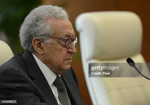 Arab League peace envoy for Syria Lakhdar Brahimi talks with Chinese Foreign Minister Yang Jiechi during their meeting at the Ministry of Foreign...