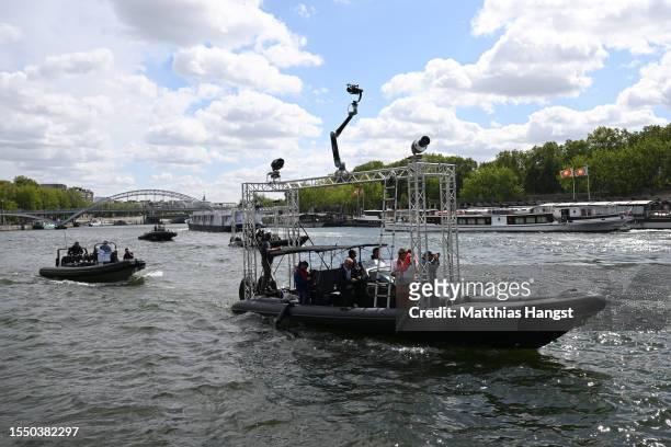 Boat with television equipment travels on the river Seine during a technical test event for the Paris 2024 opening ceremony on July 17, 2023 in...