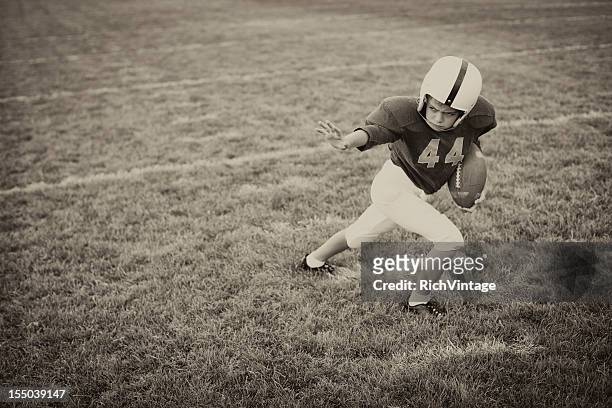 stiff arm - rush american football stockfoto's en -beelden