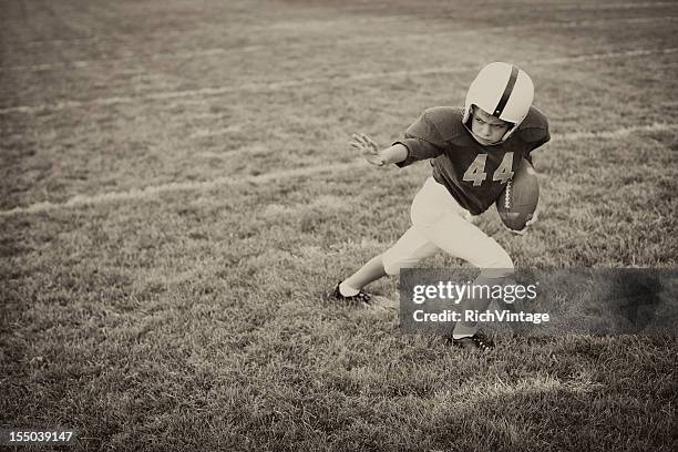 stiff arm - rush american football stock pictures, royalty-free photos & images