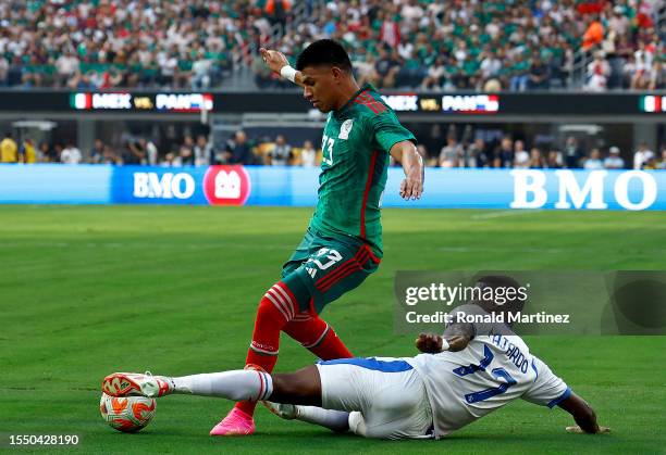 Jesus Gallardo of Mexico controls the ball against Jose Fajardo of Panama in the first half during the Concacaf Gold Cup final match between Mexico...