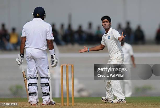 Ashok Dinda of India 'A' gestures towards Samit Patel of England after an unsuccessfull appeal for his wicket during the second day of the first...