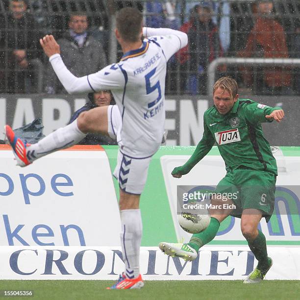 Kevin Schoeneberg of Muenster passes during the third league match between Karlsruher SC and Preussen Muenster at Wildpark Stadium on October 27,...