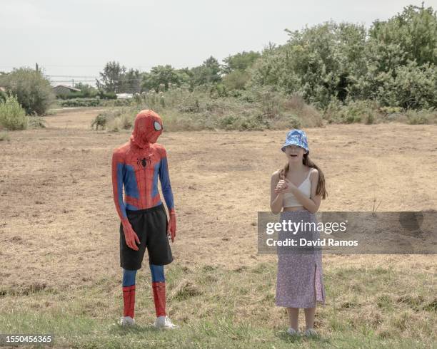 Fan in fancy dress stands roadside as he waits for the peloton of cyclists during the stage fifteen of the 110th Tour de France 2023 from Les Gets...