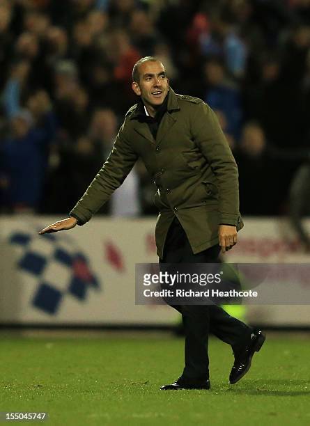 Paolo Di Canio, manager of Swindon Town gestures to fans after the Capital One Cup Fourth Round match between Swindon Town and Aston Villa at the...