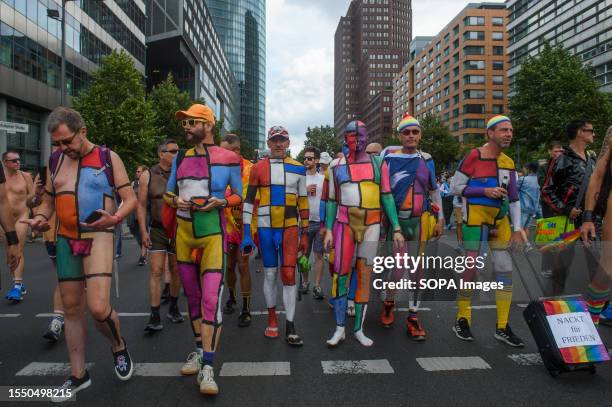 Nudists with bodypainting take part during the pride parade. Berlin Christopher Street Day or Berlin Pride Parade is an annual demonstration in...