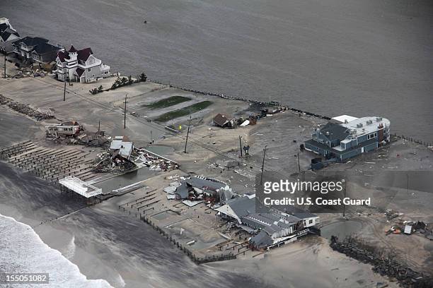 In this aerial handout image provided by the U.S. Coast Guard, a helicopter crew from Air Station Cape Cod, Massachusetts, observes property damages...