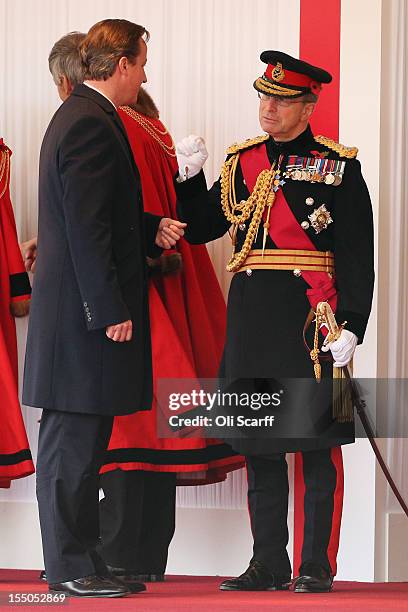 British Prime Minister David Cameron speaks with General Sir David Richards, Chief of the Defence Staff, before a Ceremonial Welcome in Horse Guards...