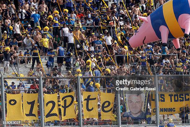 Supporters of River Plate tease Boca´s fans with a inflatable flying pig during a match between Boca Juniors and River Plate as part of the Torneo...