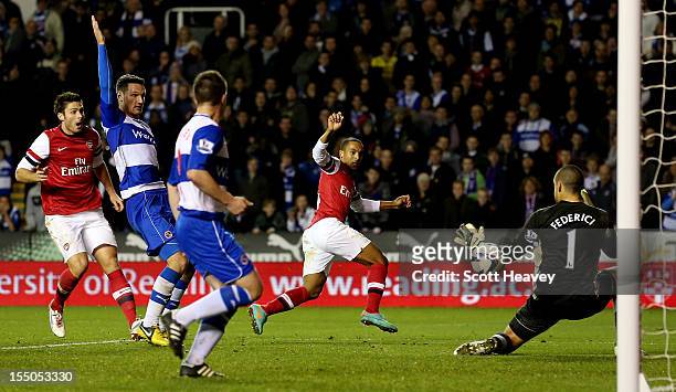 Theo Walcott of Arsenal scores their fourth goal during the Capital One Cup Fourth Round match between Reading and Arsenal at Madejski Stadium on...