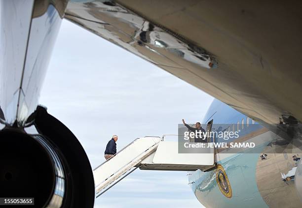 President Barack Obama and FEMA Administrator Craig Fugate board Air Force One at Andrews Air Force Base in Maryland on October 31, 2012 to leave for...