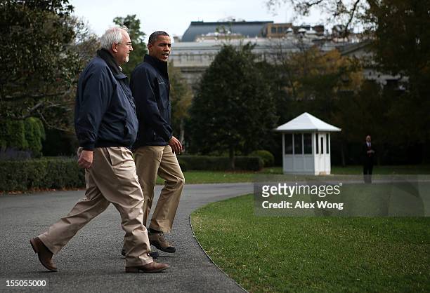 President Barack Obama walks towards the Marine One with FEMA Administrator Craig Fugate prior to his departure from the White House October 31, 2012...