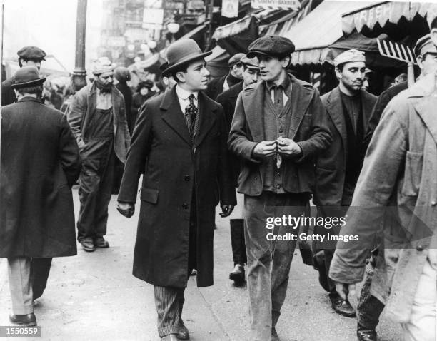 American actor Robert De Niro walking and talking with American actor Bruno Kirby in a still from the film, 'The Godfather: Part II,' directed by...