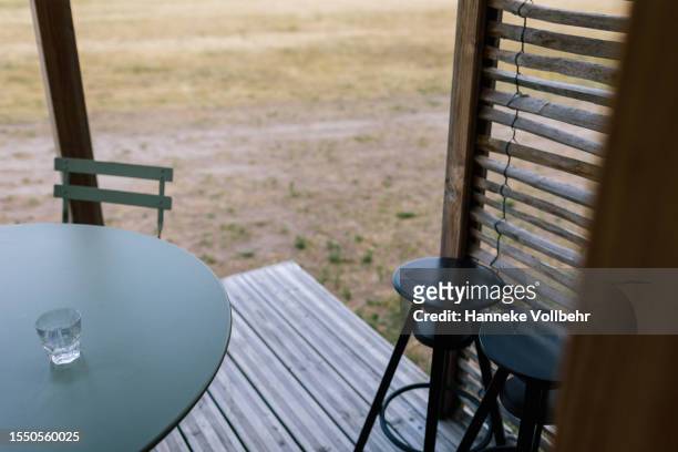 empty chairs on the veranda of a holiday glamping chalet. - hanneke vollbehr bildbanksfoton och bilder