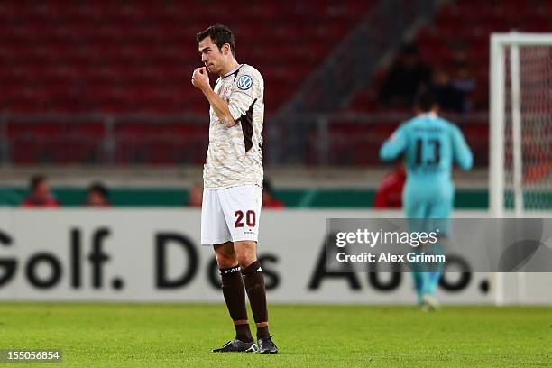 Sebastian Schachten and goalkeeper Philipp Tschauner of St. Pauli react during the second round match of the DFB Cup between VfB Stuttgart and FC...