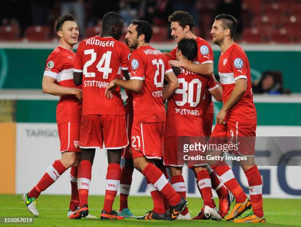 Tamas Hajnal of Stuttgart celebrates his team's third goal with team members during the second round match of the DFB Cup between VfB Stuttgart and...