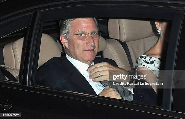 Princess Mathilde, partly seen and Prince Philippe of Belgium in their car as they arrive at Theatre des Champs-Elysees on October 31, 2012 in Paris,...