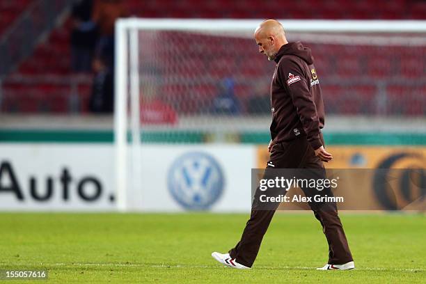 Head coach Michael Frontzeck walks over the pitch after the second round match of the DFB Cup between VfB Stuttgart and FC St.Pauli at Mercedes-Benz...