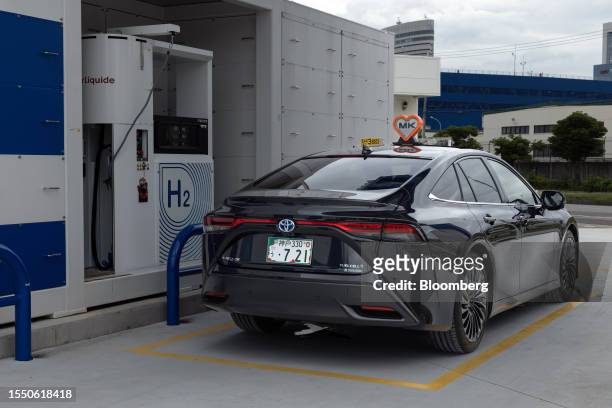 Toyota Motor Corp. Mirai hydrogen fuel cell vehicle, utilized as a taxi by MK West Group, parked at an Air Liquide hydrogen filling station in Kobe,...