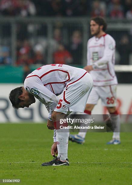 Marc Torrejon and Steven Zellner of Kaiserslautern react after their team's loss of the DFB Cup second round match between FC Bayern Muenchen and 1....