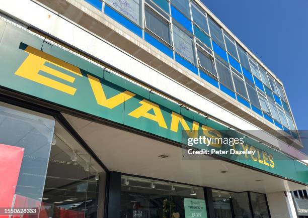 Evans Cycles store sign on building exterior, store frontage Wimbledon, ENGLAND