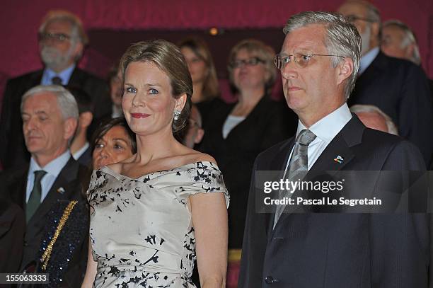 Princess Mathilde and Prince Philippe of Belgium look on after arriving at Theatre des Champs-Elysees to attend the 'Liege A Paris' Concert performed...