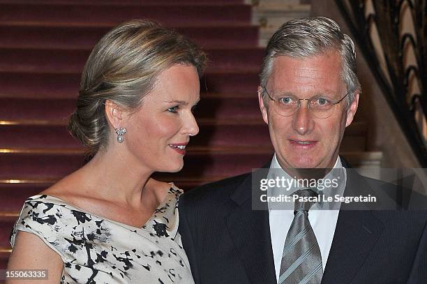 Princess Mathilde and Prince Philippe of Belgium pose as they arrive at Theatre des Champs-Elysees to attend the 'Liege A Paris' Concert performed by...