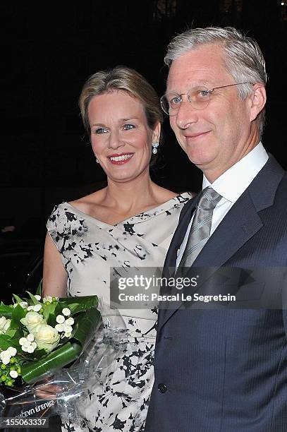 Princess Mathilde and Prince Philippe of Belgium arrive at Theatre des Champs-Elysees to attend the 'Liege A Paris' Concert performed by the Liege...