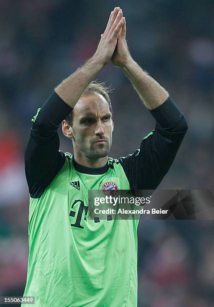 Goalkeeper Tom Starke of Bayern Muenchen applauds to the fans after his team's victory of the DFB Cup second round match between FC Bayern Muenchen...