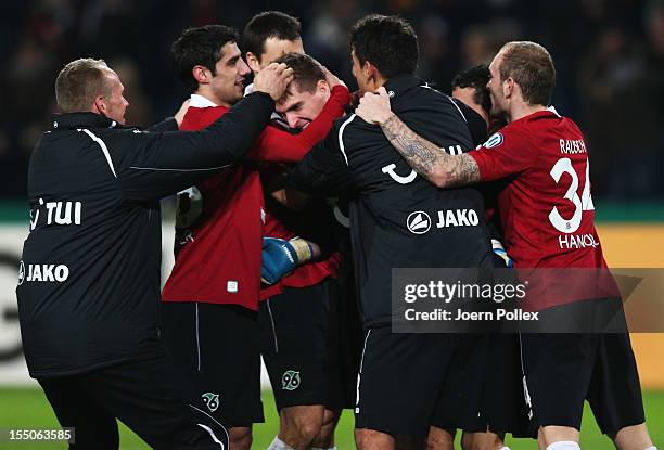 Ron-Robert Zieler of Hannover celebrates with his team mates afer winning during the second round DFB Cup match between Hannover 96 and Dynamo...