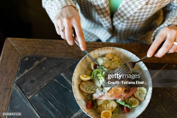 close-up of woman eating salad with shrimps in restaurant - istra istrinsky district stock pictures, royalty-free photos & images