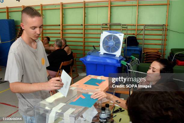 Andres, 19 years old, casts his vote for the first time during the General Elections in Hospitalet. The general elections were held where more than...